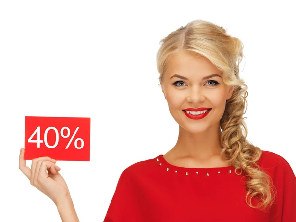 Lovely woman in red dress with discount card — Stock Photo, Image