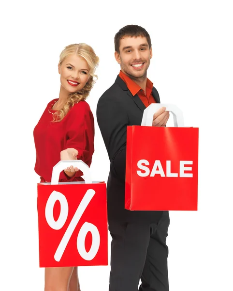 Uomo e donna con shopping bag — Foto Stock