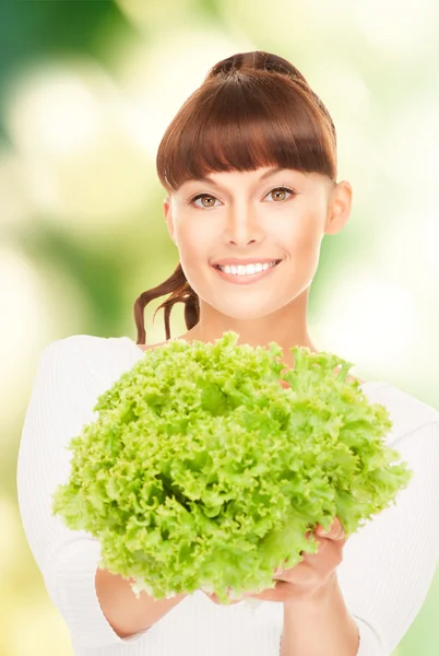 Beautiful housewife with lettuce — Stock Photo, Image