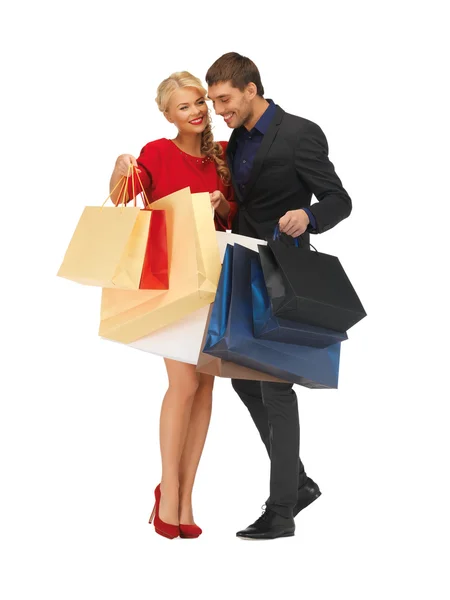 Hombre y mujer con bolsas de compras — Foto de Stock