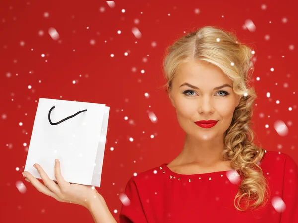 Lovely woman in red dress with shopping bag — Stock Photo, Image