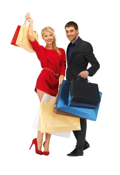 Man en vrouw met boodschappentassen — Stockfoto