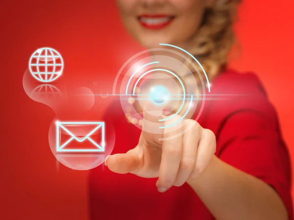 Woman in red dress pressing virtual button — Stock Photo, Image