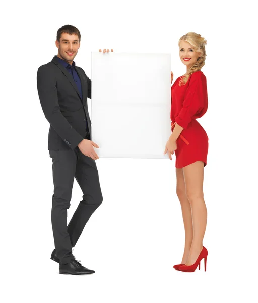 Couple holding big blank board — Stock Photo, Image