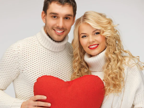 Family couple in a sweaters with heart — Stock Photo, Image