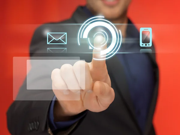 Handsome man in suit pressing virtual button — Stock Photo, Image