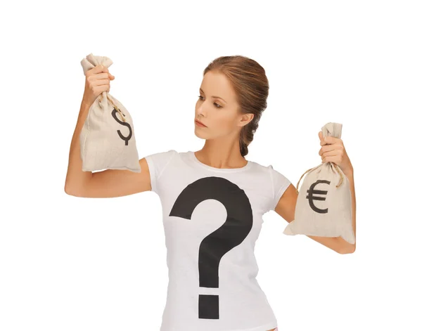 Woman with dollar and euro signed bags — Stock Photo, Image