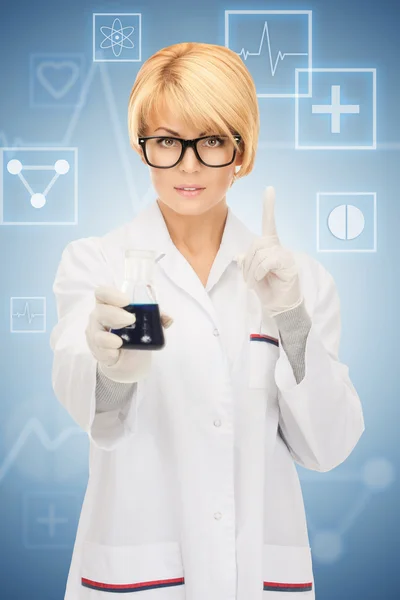 Lab worker holding up test tube — Stock Photo, Image