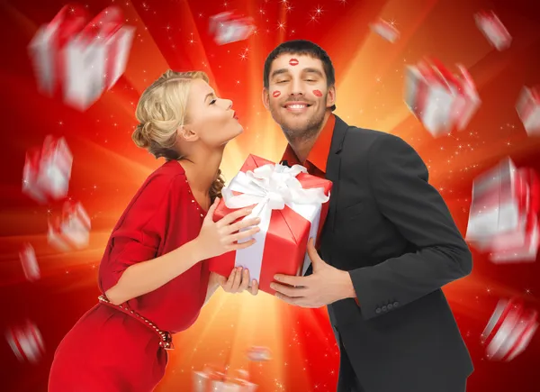 Man and woman with present — Stock Photo, Image