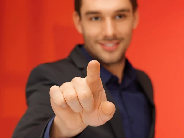 Bonito homem de terno pressionando botão virtual — Fotografia de Stock