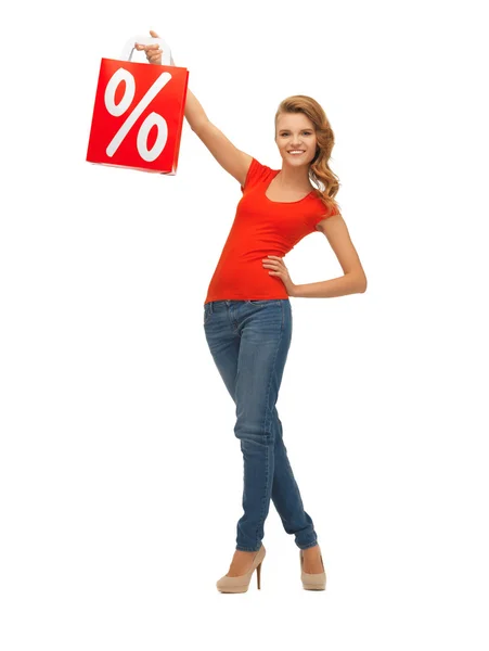 Teenage girl in red t-shirt with shopping bag — Stock Photo, Image