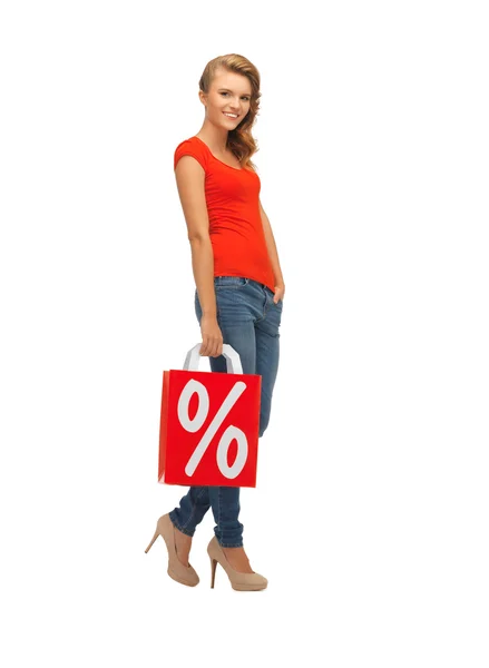 Teenage girl in red t-shirt with shopping bag — Stock Photo, Image