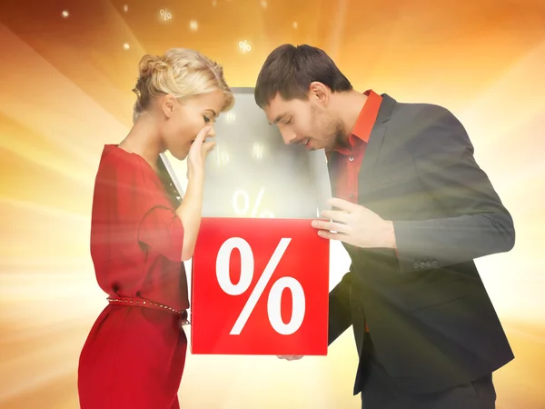 Man and woman with percent sign — Stock Photo, Image