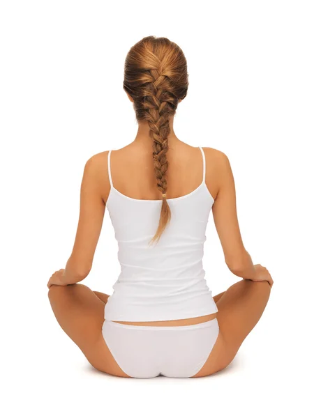 Woman in undrewear practicing yoga lotus pose — Stock Photo, Image