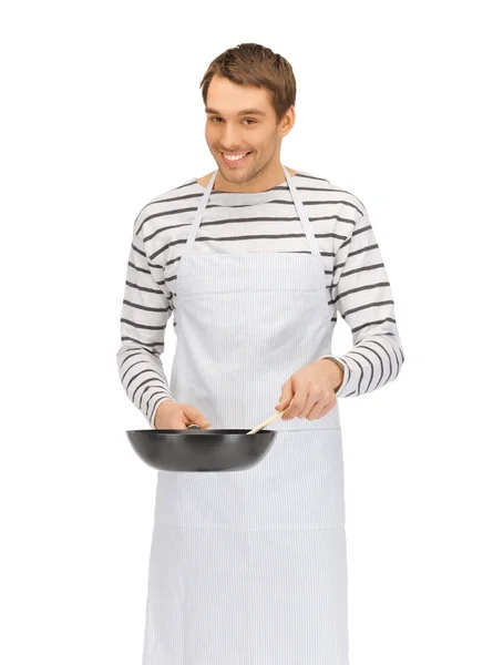 Handsome man with pan and spoon Stock Picture