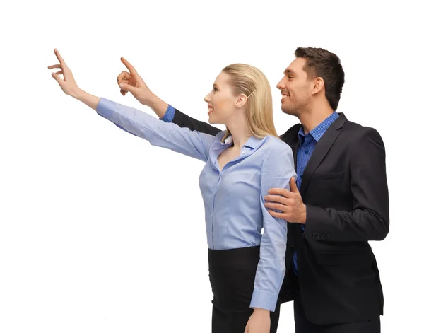 Man and woman working with something imaginary — Stock Photo, Image