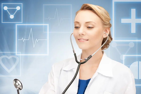 Attractive female doctor with stethoscope — Stock Photo, Image