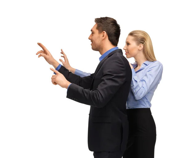 Man and woman working with something imaginary — Stock Photo, Image