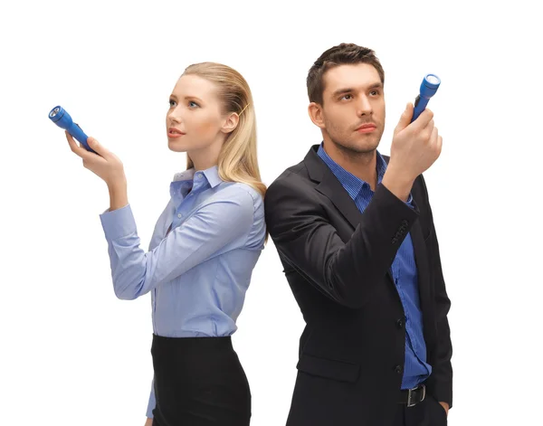 Man and woman with flashlights — Stock Photo, Image