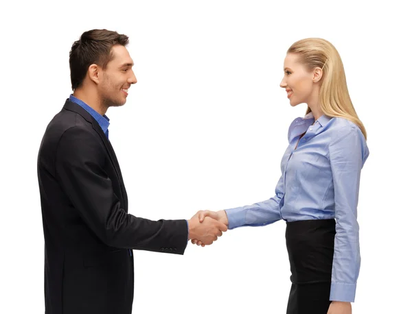 Hombre y mujer estrechando sus manos — Foto de Stock