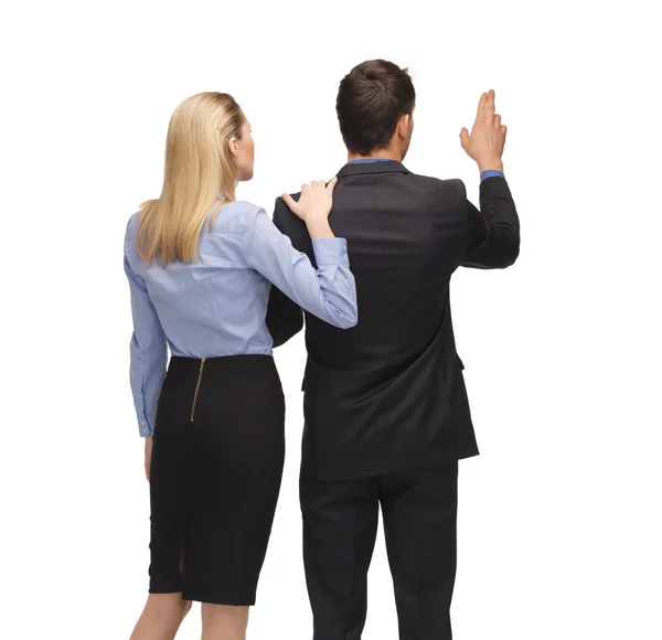 Man and woman working with something imaginary — Stock Photo, Image