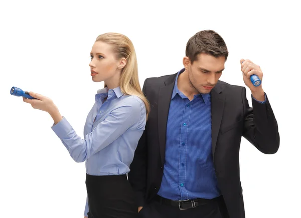 Man and woman with flashlights — Stock Photo, Image