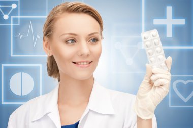 Attractive female doctor with pills clipart