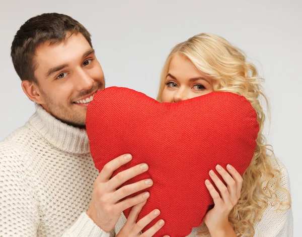 Family couple in a sweaters with heart — Stock Photo, Image