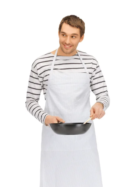 Handsome man with pan and spoon — Stock Photo, Image