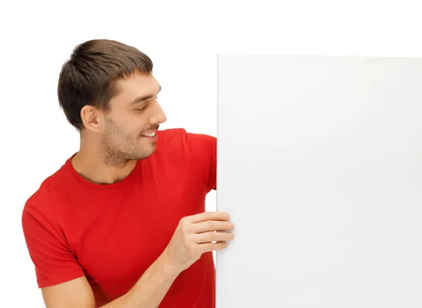 Homem bonito com grande placa em branco — Fotografia de Stock