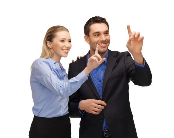 Homem e mulher trabalhando com algo imaginário — Fotografia de Stock