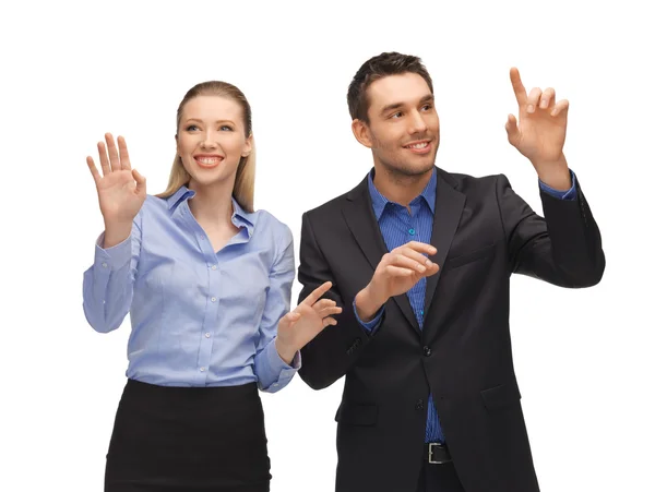 Man and woman working with something imaginary — Stock Photo, Image