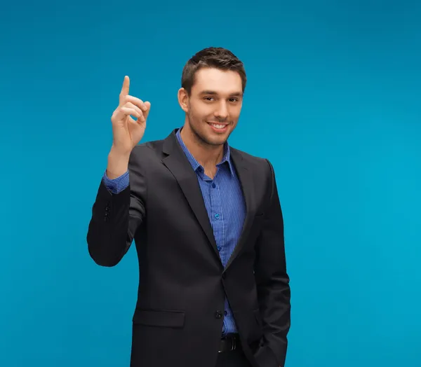 Man in suit with his finger up — Stock Photo, Image