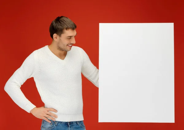 Homem bonito com grande placa em branco — Fotografia de Stock