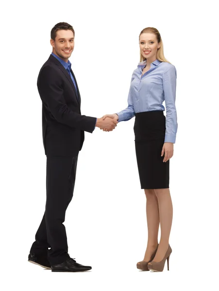 Hombre y mujer estrechando sus manos — Foto de Stock