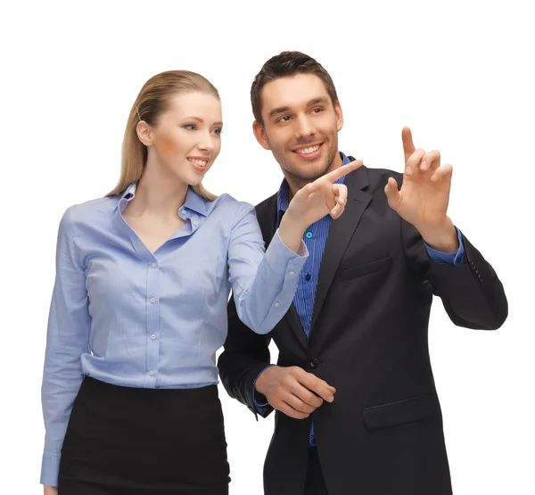 Hombre y mujer trabajando con algo imaginario —  Fotos de Stock