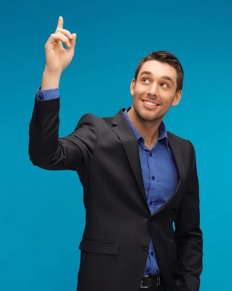 Man in pak met zijn vinger omhoog — Stockfoto