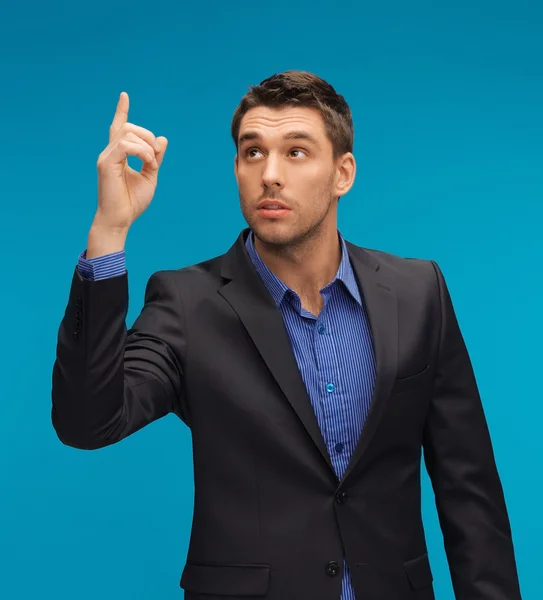Mann im Anzug mit erhobenem Finger — Stockfoto