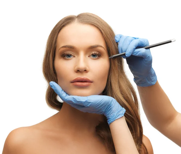 Woman face and beautician hands — Stock Photo, Image