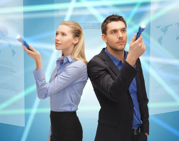 Man and woman with flashlights — Stock Photo, Image