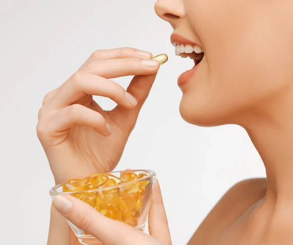 Woman with vitamins — Stock Photo, Image