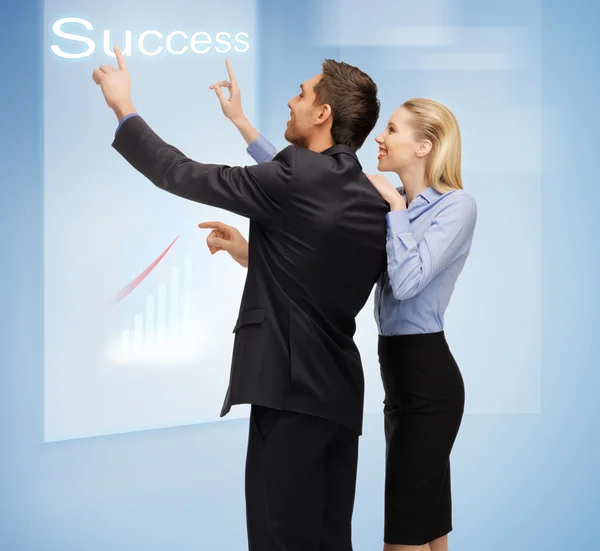 Man and woman working with virtual touch screens — Stock Photo, Image