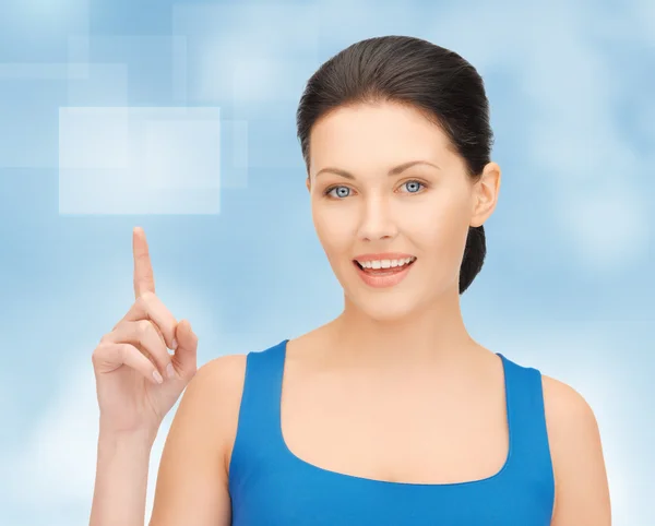 Beautiful woman pointing her finger — Stock Photo, Image