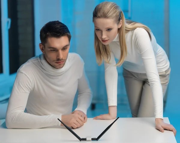 Man and woman working with something — Stock Photo, Image