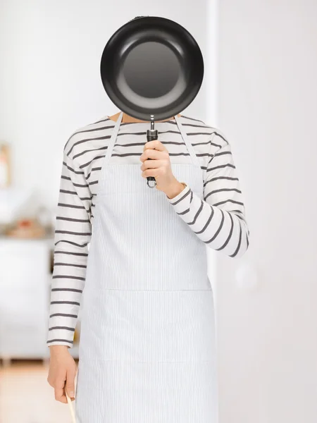 Man with pan at kitchen — Stock Photo, Image