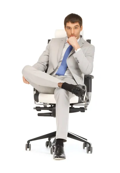 Man sitting in chair — Stock Photo, Image