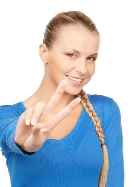 Young woman showing victory sign — Stock Photo, Image