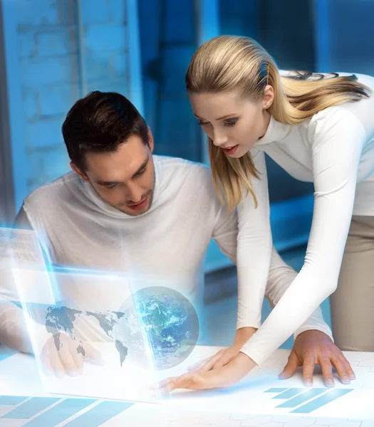 Man and woman working with virtual screen — Stock Photo, Image