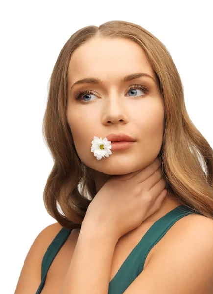 Woman with camomile in mouth — Stock Photo, Image