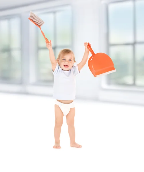 Baby boy with with dustpan and brush — Stock Photo, Image